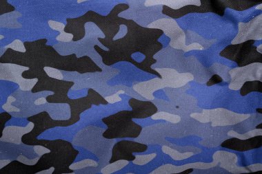 Açık hava kamuflaj örgüsü, askeri branda deseni, kamuflaj kumaşı dokusu, ordu tuvali arka planı.