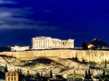 Night view of the Parthenon temple on the Acropolis hill of Athens, Greece
