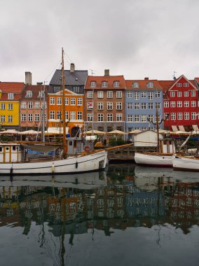 Copenhagen, Denmark - December 7, 2023: Colorful Nyhavn waterfront, canal and entertainment district during Christmas in Copenhagen, Denmark  clipart