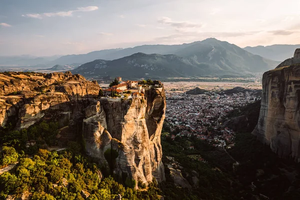 stock image Aerial view of monasteries Trinity and breathtaking pictures of valley and landmark canyon of Meteora at sunset, Kalambaka, Greece, shadows, twisted road, bridge, Mountains as columns