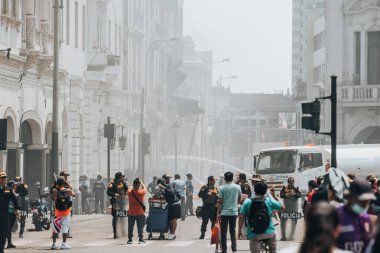 Lima, Peru - January 20, 2023: Firefighters firemen trying to control burning historical building. High quality photo