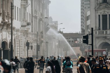 Lima, Peru - January 20, 2023: Firefighters firemen trying to control burning historical building. High quality photo