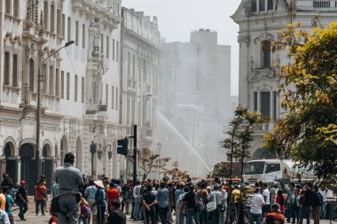 Lima, Peru - January 20, 2023: Firefighters firemen trying to control burning historical building. High quality photo