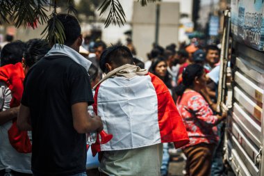Lima, Peru - January 20, 2023: Political Protests and demonstrations with flags on the streets of Lima. High quality photo