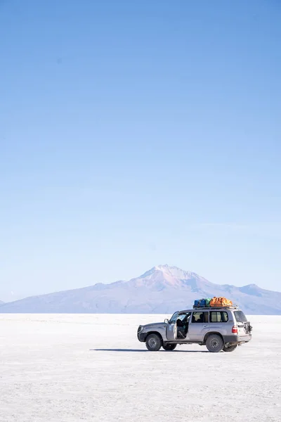 Photo of Car Bolivia Salar de Uyuni Salt Flats. High quality photo