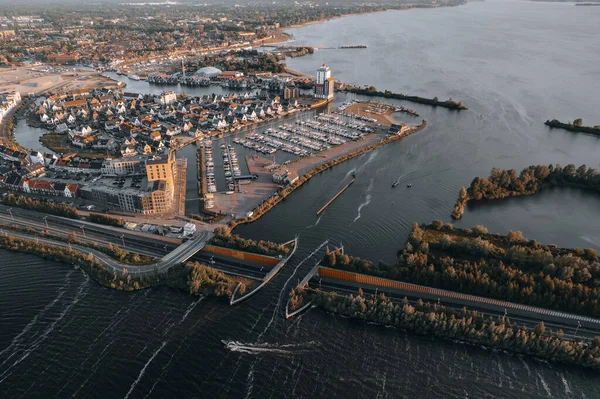 stock image Aerial view of boat crossing aquaduct in Harderwijk, Veluwemeer The Netherlands. High quality 4k footage