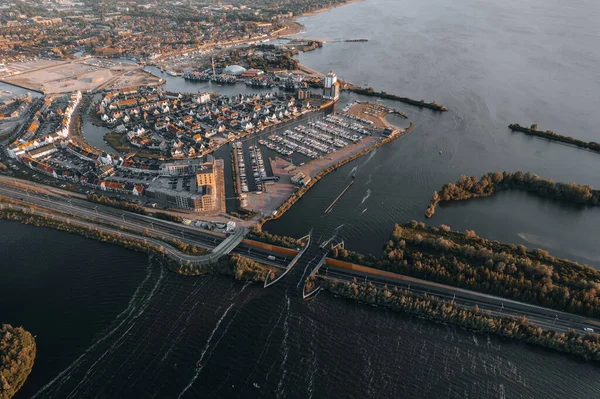 stock image Aerial view of boat crossing aquaduct in Harderwijk, Veluwemeer The Netherlands. High quality 4k footage