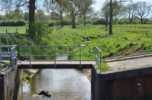 stock image A little weir in the river near the village of Sambeek