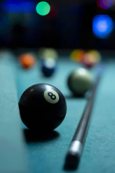 Behind the 8 Ball - Billiard balls on a Pool Table