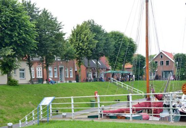Boat on the Canal in the Town Carolienensiel at the North Sea, Lower Saxony