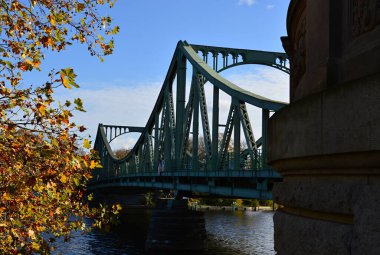 Autumn at the Bridge Glienicker Bruecke over the River Havel between Potsdam and Berlin clipart