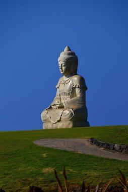 Buddha Statue at the Pacific in Waikoloa on Big Island, Hawaii clipart