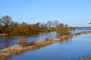 Flood in Winter at the River Aller in the Town Rethem, Lower Saxony clipart