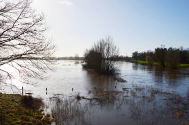 Flood in Winter at the River Aller in the Town Rethem, Lower Saxony clipart