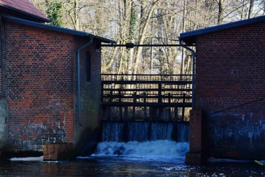 Historical Water Mill in the Vilage Mueden at the River Oertze, Lower Saxony clipart