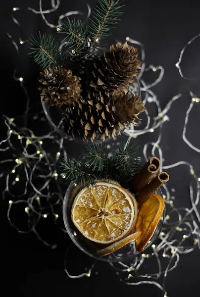 Dark Background Two Transparent Glasses New Year Decoration Oranges Cinnamon — Stock Photo, Image