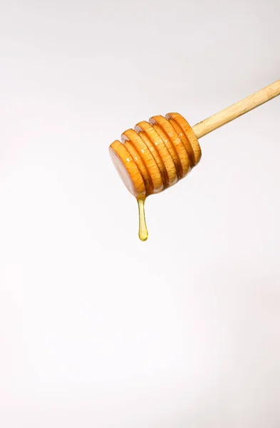Wooden Spoon Honey White Background Drop Fragrant Yellow Honey Drips — Stock Photo, Image