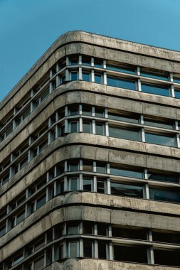 windows of an old office building in the sun on a sunny day