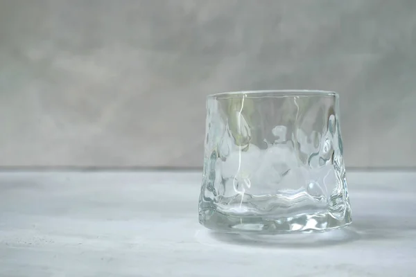 stock image a close-up shot of a transparent glass cup in empty space