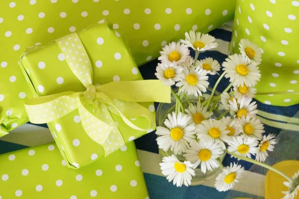 gift box with flowers and green leaves