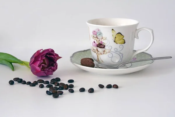 cup of coffee with flowers and leaves