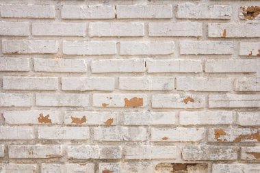 Dökülen alçı ve desenli eski, eski, kirli tuğla duvarın arka planı