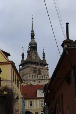 Different angles showing the upper part of the clock tower in Sighisoara