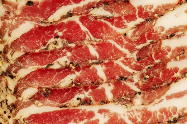 Ham. Slices of ham close-up. Pork meat, background texture