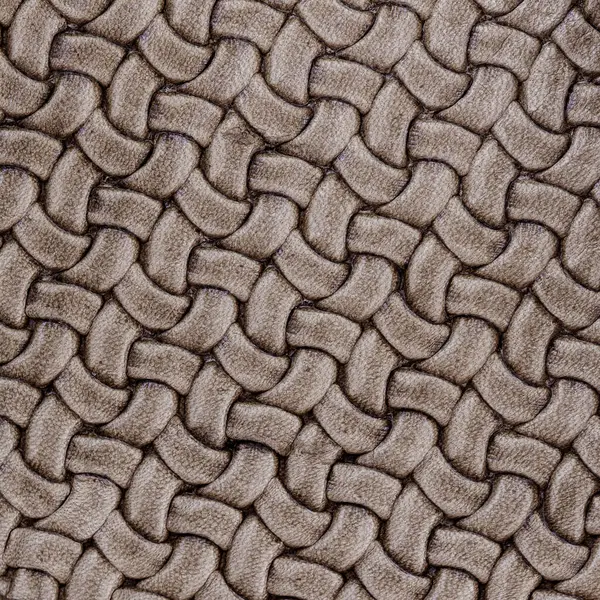 Texture of genuine Braided leather close-up. Fashion trend leather background, copy space, substrate composition use
