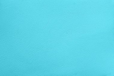 Yumuşak turkuaz deri dokusunun minimalist yakın çekimi. Parlak turkuaz desenli arka plan tasarım projeleri, yaratıcı sanat eserleri, arka plan, moda tasarımı için kusursuz, pürüzsüz ve canlı bir renk.