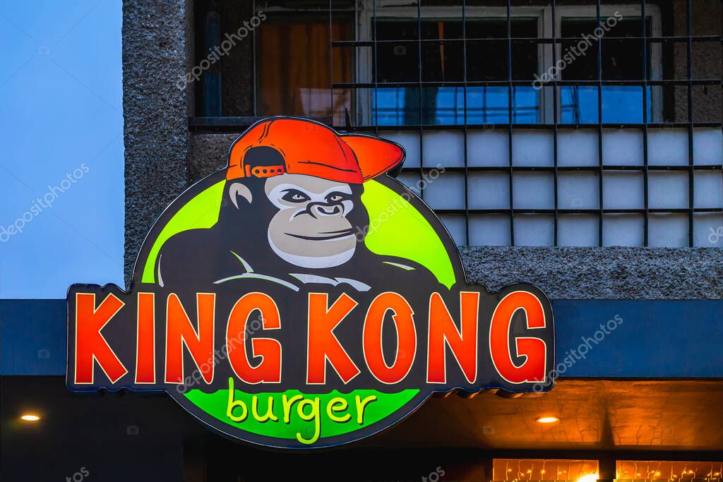 Vibrant King Kong Burger sign featuring cartoon gorilla with cap outside burger joint, Burgas, Bulgaria. Playful branding combines burger culture, bold urban fast food concept