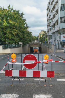 BURGAS, BULGARIA - 04 OCTOBER, 2025: Street tunnel blocked by police tape, warning signs after flooding incident. Concept of Consequences of flooding, urban safety, infrastructure emergency