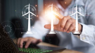 Parlayan dijital rüzgar türbini hologramıyla cep telefonuna işaret eden iş adamının elini kapat. Rüzgar jeneratörü konsepti.