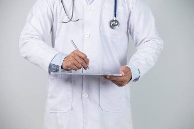 Medicine doctor with stethoscope touching medical icon network connection and modern interface on digital tablet on hospital background. Medical technology network concept