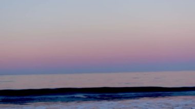 Beautiful sunny and pink sunrise on the beach