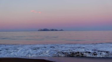 Beautiful sunny and pink sunrise on the beach