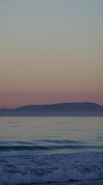 Beautiful sunny and pink sunrise on the beach