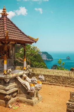 Religious building, traditional Balinese temple on the background of the ocean. Bali, Indonesia. High quality photo