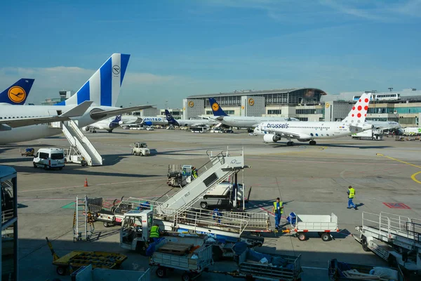 stock image Frankfurt Airport Germany August 02, 2022 - Airplanes and some luggage trolleys at the terminal