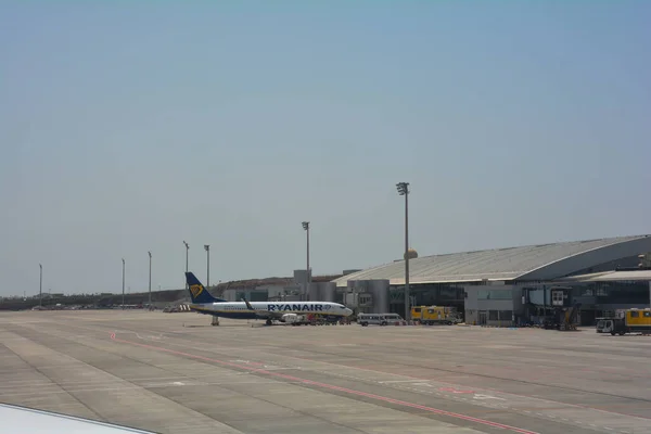 stock image Tenerife South Airport Spain August 02, 2022 -  Reina Sofa Airport terminal from the outside with Ryanair plane