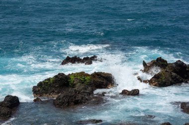 Rocks in the breakers on the coast of the Canary Island of Tenerife, Spain
