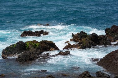 Rocks in the breakers on the coast of the Canary Island of Tenerife, Spain