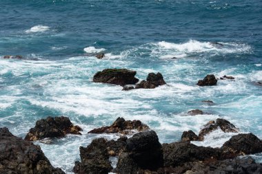 Rocks in the breakers on the coast of the Canary Island of Tenerife, Spain