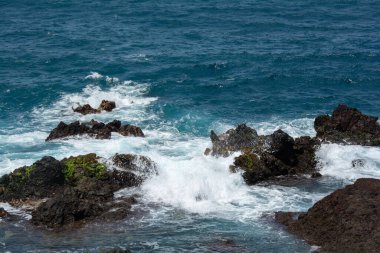 Rocks in the breakers on the coast of the Canary Island of Tenerife, Spain