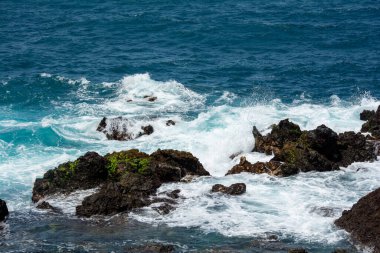 Rocks in the breakers on the coast of the Canary Island of Tenerife, Spain