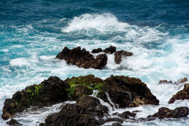 Rocks in the breakers on the coast of the Canary Island of Tenerife, Spain