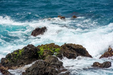 Rocks in the breakers on the coast of the Canary Island of Tenerife, Spain