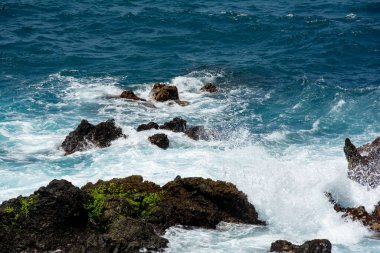 Rocks in the breakers on the coast of the Canary Island of Tenerife, Spain