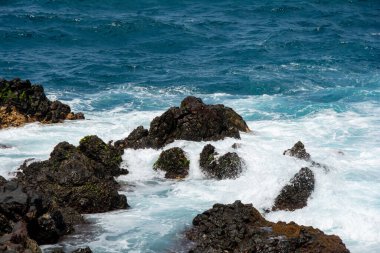 Rocks in the breakers on the coast of the Canary Island of Tenerife, Spain