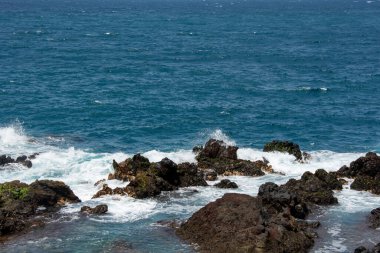 Rocks in the breakers on the coast of the Canary Island of Tenerife, Spain